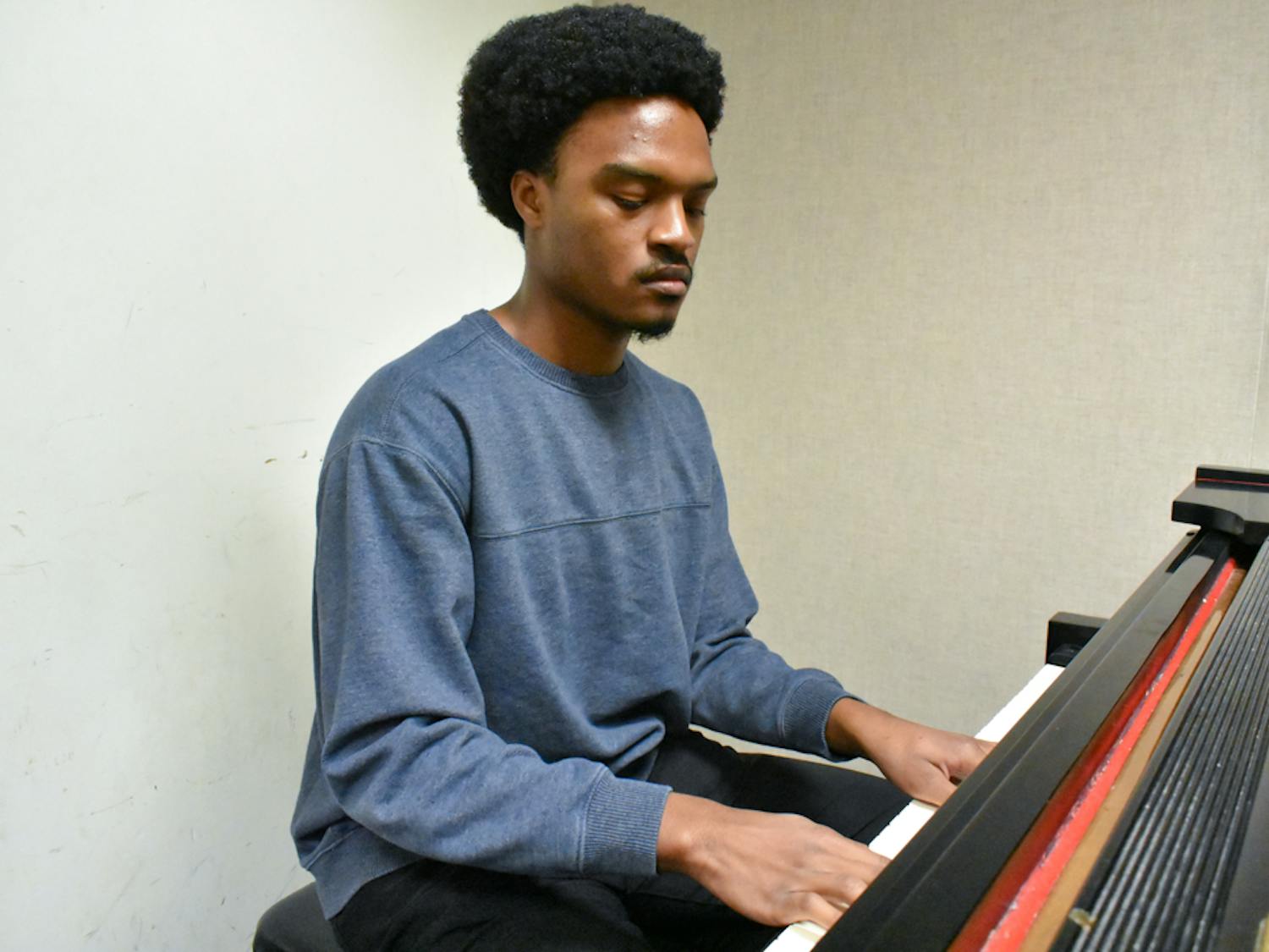 Medley practices playing the piano before the ensemble’s rehearsal on Feb. 7, 2023. Medley said he believes that music helps to “really emphasize the emotion that you’re feeling and to be able to process it in that moment.”