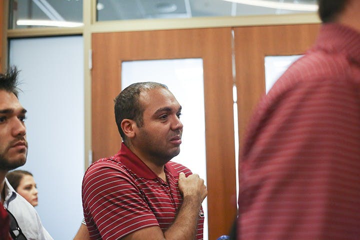 Protestors stand in silent shock following the selection of Gen. Robert Caslen as USC's next president.&nbsp;