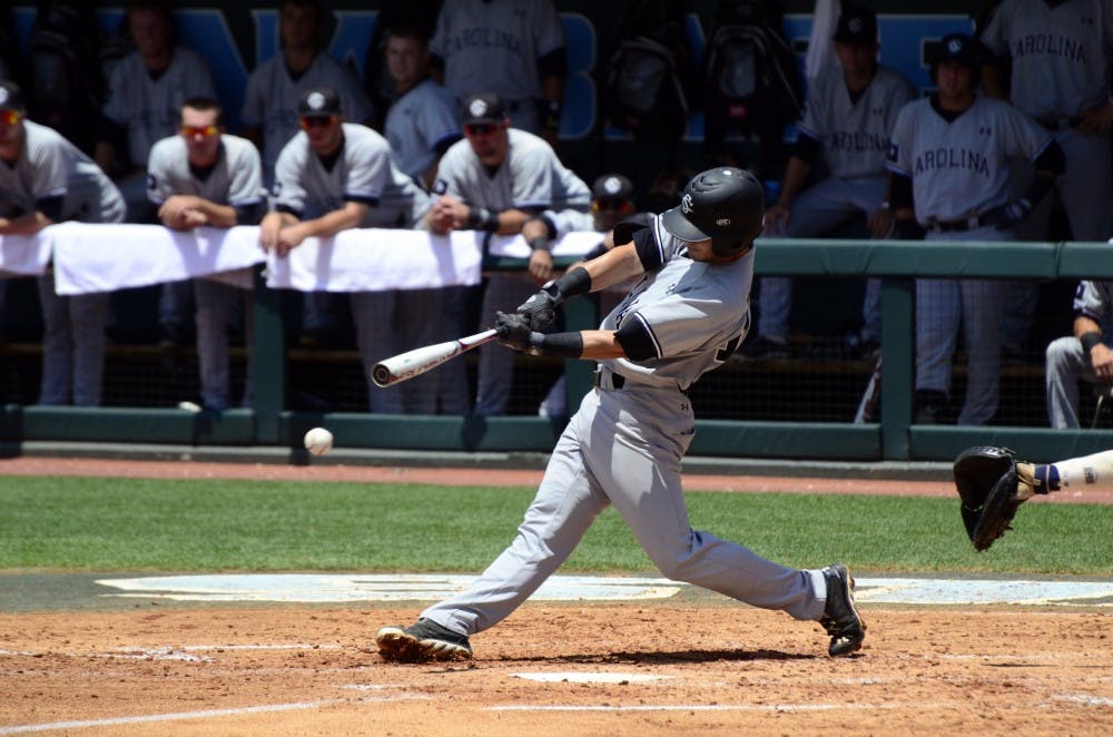 Gamecocks third baseman Chase Vergason hits a ground ball.