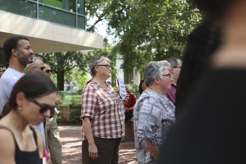 A supporter holds a sign during the "Gamecocks4Integrity" rally on the Russell House patio on Wednesday.&nbsp;