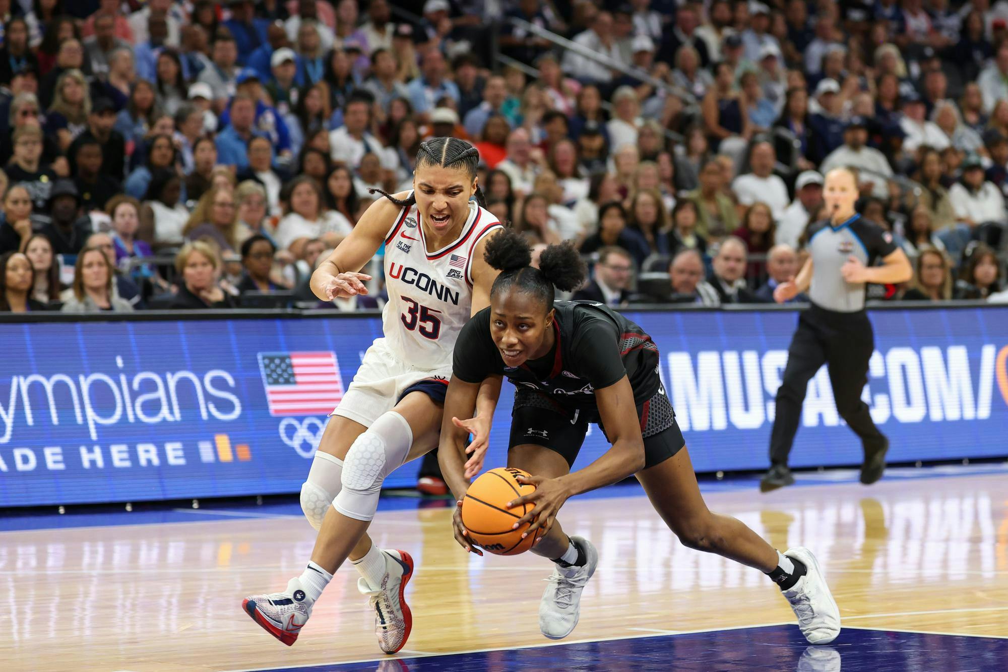 Sophomore forward Joyce Edwards trips while fouled by graduate guard Azzi Fudd during the semifinal game against UConn on April 3, 2026. Edwards shot 5-14 and made eight rebounds.