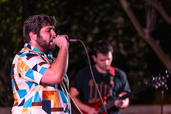 The House Band singer and third-year international business and finance student Tyler Bomse (on left) and guitarist and third-year finance student Carter Vogt (on right) perform at the Battle of the Bands on Oct. 5, 2022. The House Band was selected as the winners of the competition.&nbsp;
