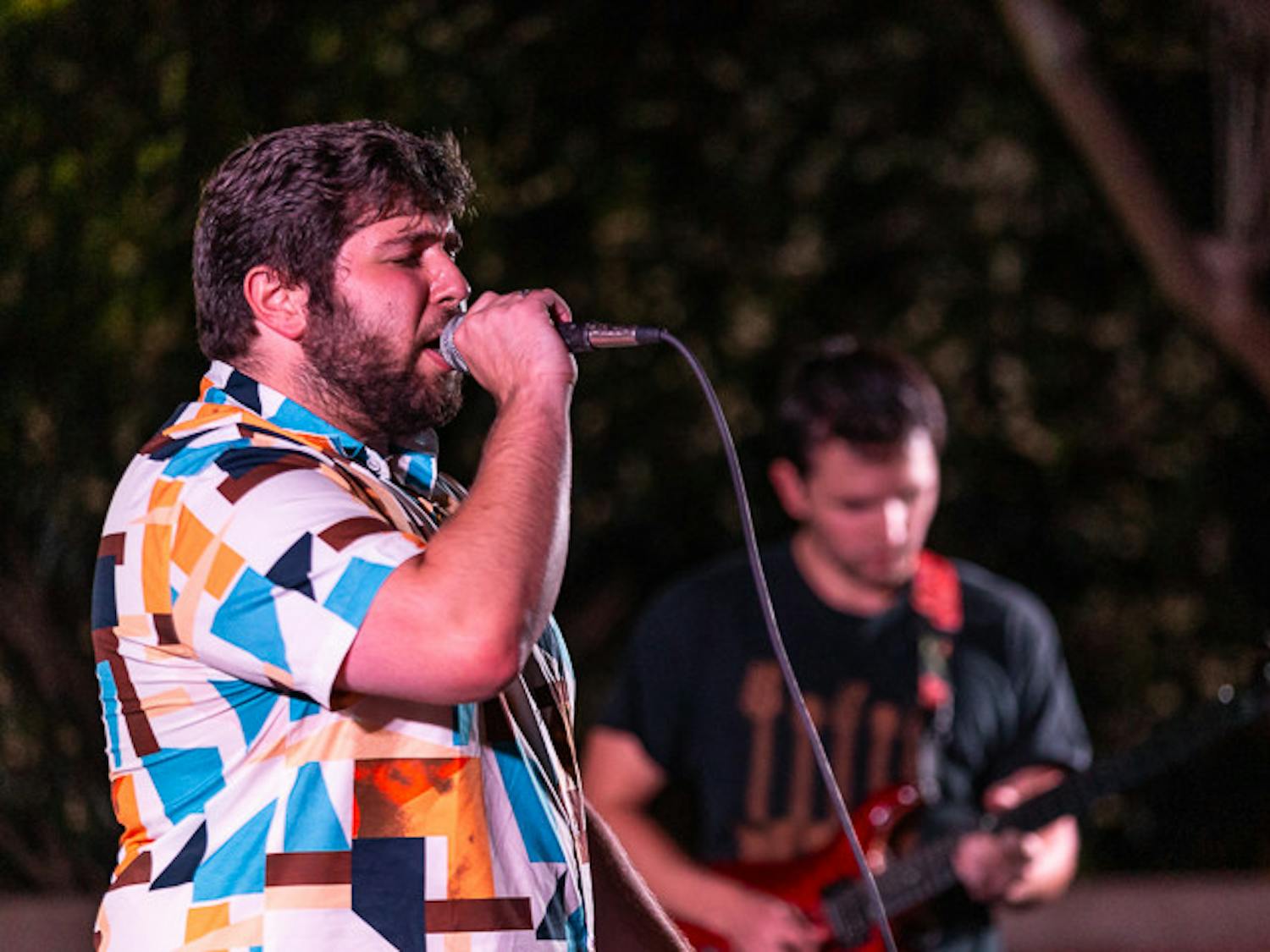 The House Band singer and third-year international business and finance student Tyler Bomse (on left) and guitarist and third-year finance student Carter Vogt (on right) perform at the Battle of the Bands on Oct. 5, 2022. The House Band was selected as the winners of the competition.&nbsp;