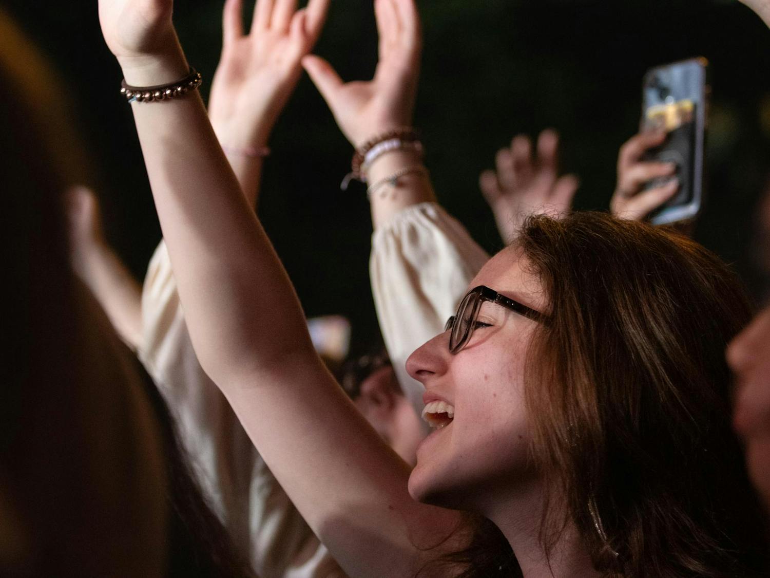 Students sing along to the band COIN at Cockstock on Oct. 6, 2023. COIN performed for approximately an hour on a stage set up on Greene Street.