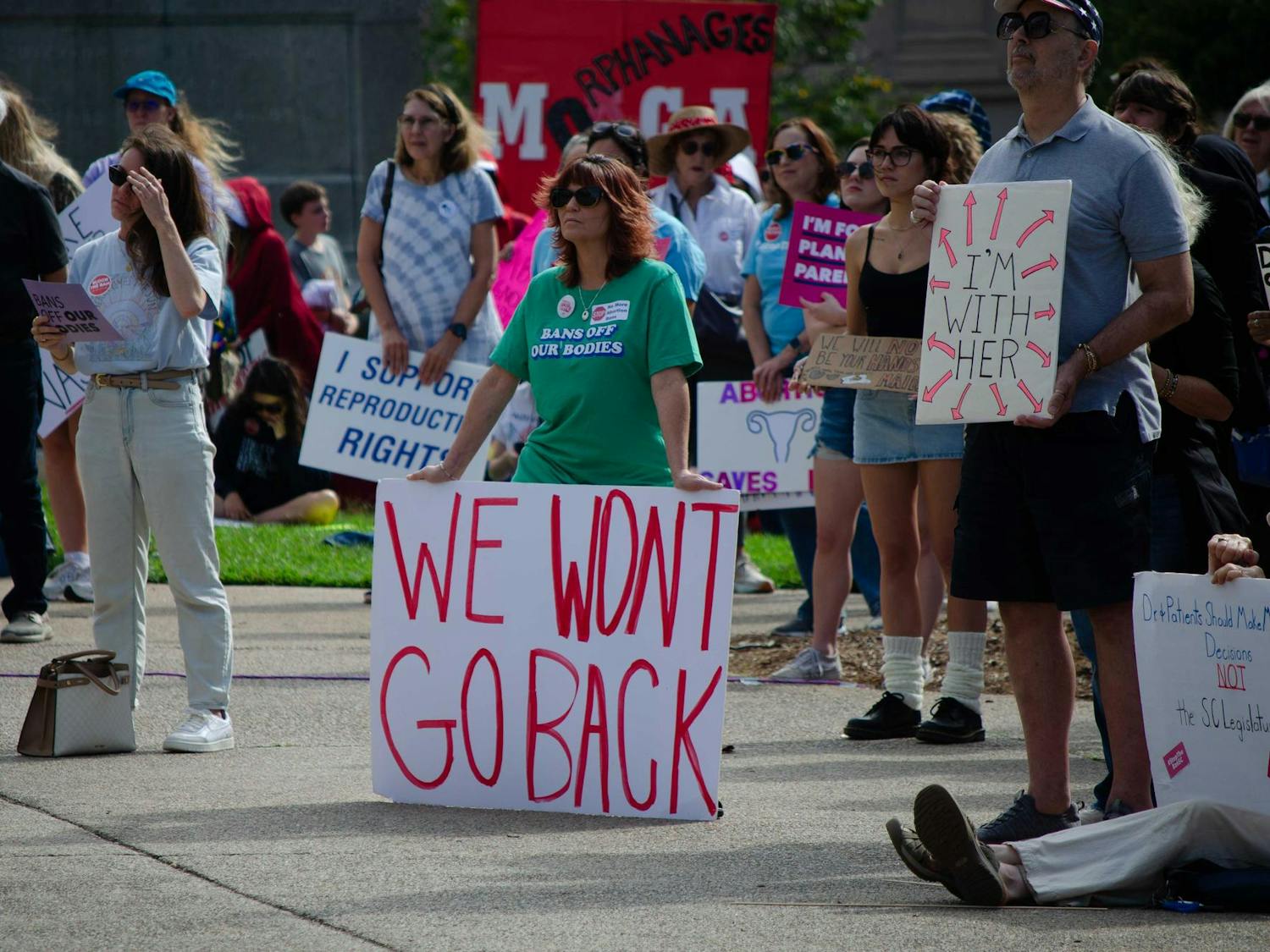A protestor against Senate Bill 323 holds a sign that says “WE WONT GO BACK” at the South Carolina State Capitol on Oct. 1, 2025. Senate Bill 323 includes a total ban on abortion and would redefine the legal meaning of contraception.