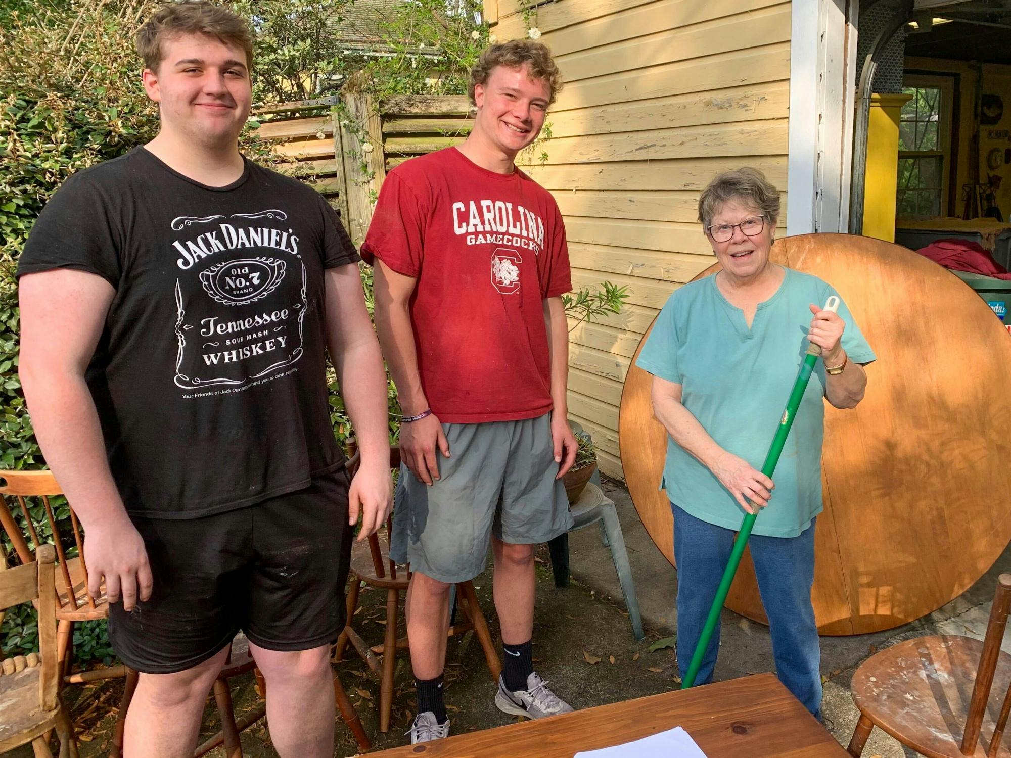 Second-year student Brogan Theobald and first-year student Peter Blackburn assist community member through the rent-a-rugger program on March 13, 2022. Members of the Rugby club has raised approximately $4000 through this program.&nbsp;