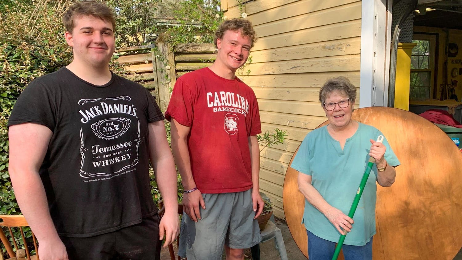 Second-year student Brogan Theobald and first-year student Peter Blackburn assist community member through the rent-a-rugger program on March 13, 2022. Members of the Rugby club has raised approximately $4000 through this program.&nbsp;