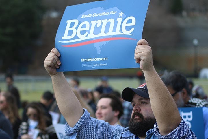 Bernie Sanders supporter Clay Haill holds up a sign in support at Friday’s Bernie 2020 South Carolina rally at Finlay Park.