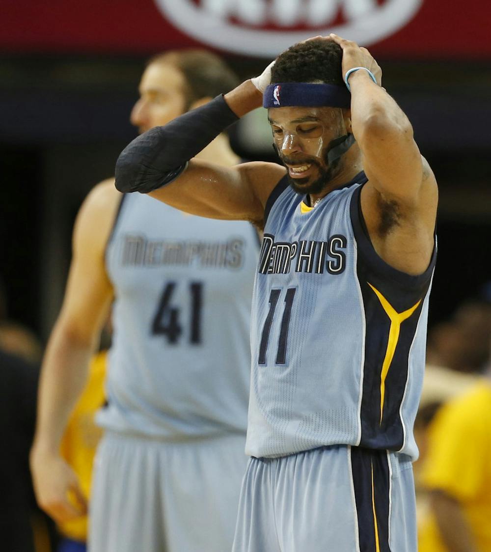 The Memphis Grizzlies' Mike Conley (11) reacts in the third quarter against the Golden State Warriors during Game 5 in the Western Conference semifinals at Oracle Arena in Oakland, Calif., on Wednesday, May 13, 2015. (Ray Chavez/Bay Area News Group/TNS)
