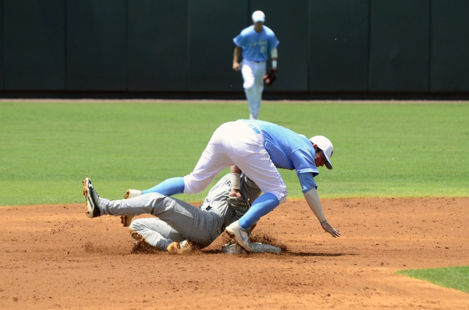 Tanner English collides with the UNC second baseman while sliding into second.