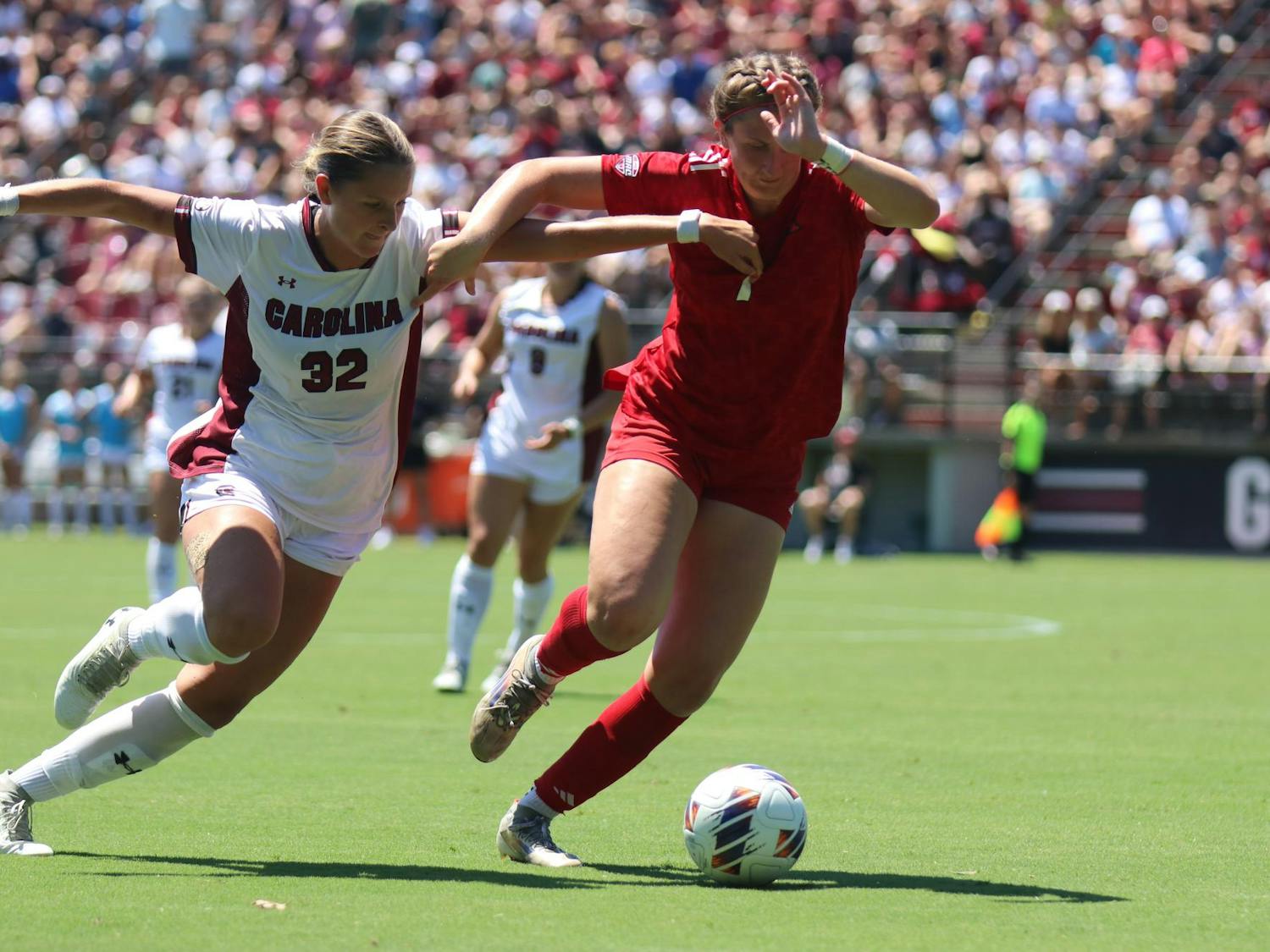 Junior midfielder Cuyler Zulauf attempts to steal a ball against a Miami Ohio player on Aug. 24, 2025 at Stone Stadium. Zulauf attempted a penalty kick, scoring a goal and leading the Gamecocks 2-0 against the Redhawks.