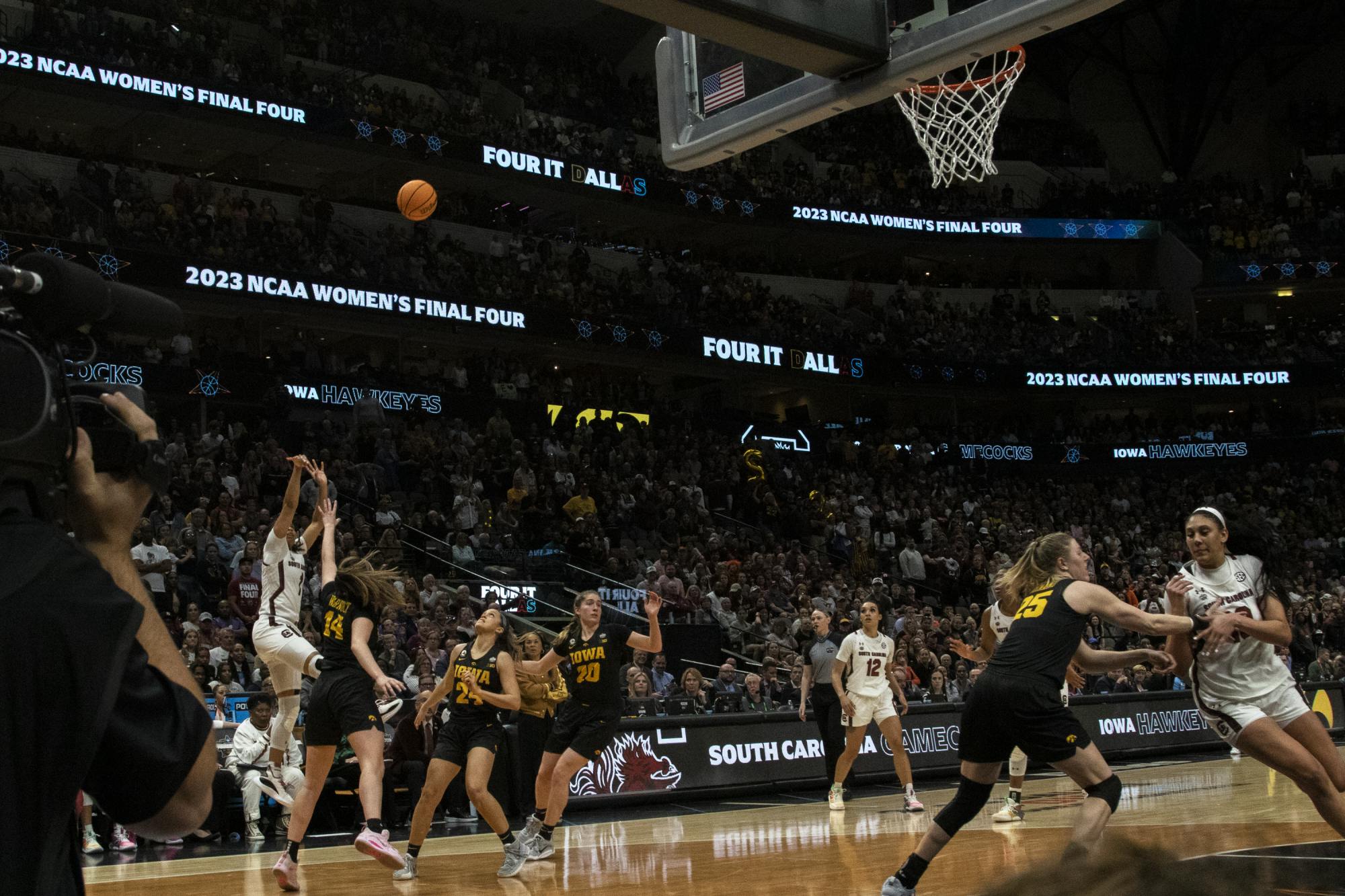 Cooke steps back and attempts a 3-pointer to decrease the score deficit in the Final Four match against the University of Iowa on March 31, 2023. Cooke led her team, making 18 points and five assists in the first half of the game, and was named the Ann Meyers Drysdale Shooting Guard of the Year.