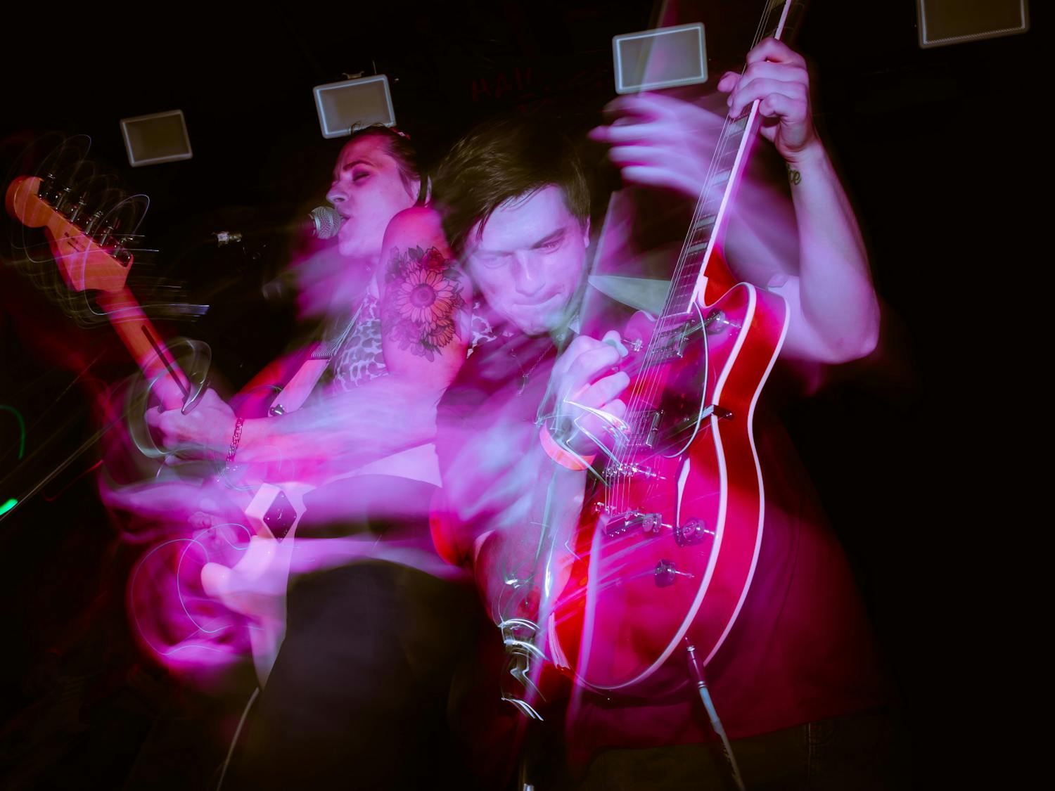 A long exposure shot of Charlie Boy band members, frontwoman Kat Hammond and guitarist Tyler Gordon, performing on July 1, 2022. The group has performed at New Brooklyn Tavern but is looking to expand its unique sound beyond Columbia.