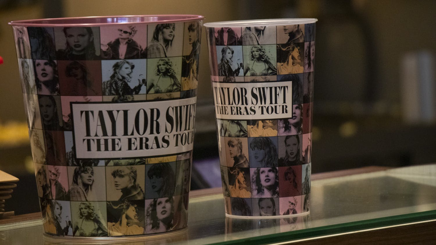 An Eras-themed popcorn bucket and drink cup sit ready for customers to purchase at AMC Harbison 14. Taylor Swift fans gathered in theaters across the country over the weekend to attend the widely-anticipated Eras Tour concert film.