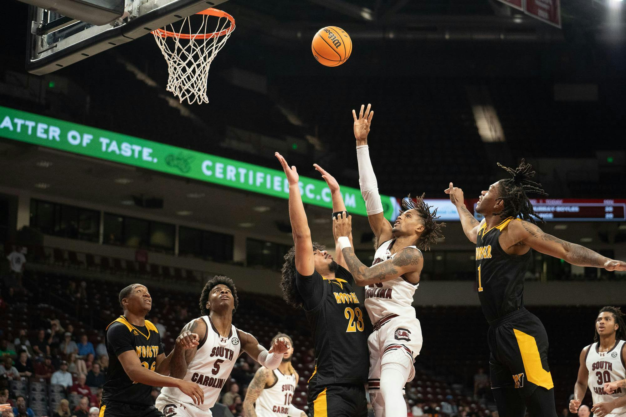 Freshman guard Cam Scott battles past the opposing defense to score during South Carolina's game against Wooster on Oct. 30, 2024, at Colonial Life Arena. The two-time South Carolina Gatorade Player of the Year is in his first season with the Gamecocks.