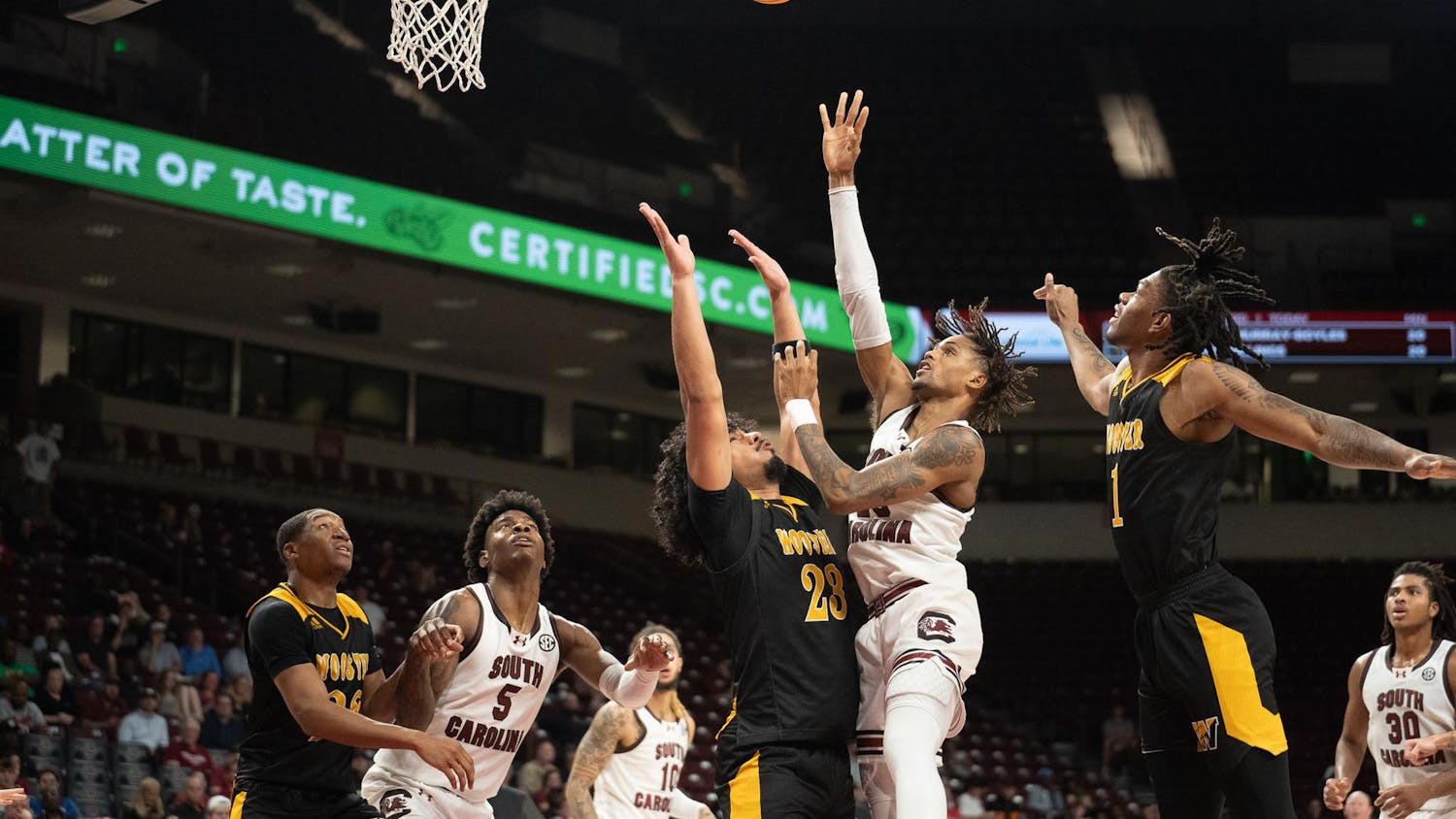 Freshman guard Cam Scott battles past the opposing defense to score during South Carolina's game against Wooster on Oct. 30, 2024, at Colonial Life Arena. The two-time South Carolina Gatorade Player of the Year is in his first season with the Gamecocks.