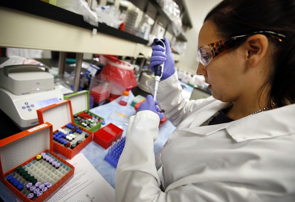Stephanie Wiltzius, Associate Scientist at Kite Pharma, sets up samples for an experiment at the Santa Monica facility on Sept. 29, 2015. (Al Seib/Los Angeles Times/TNS)