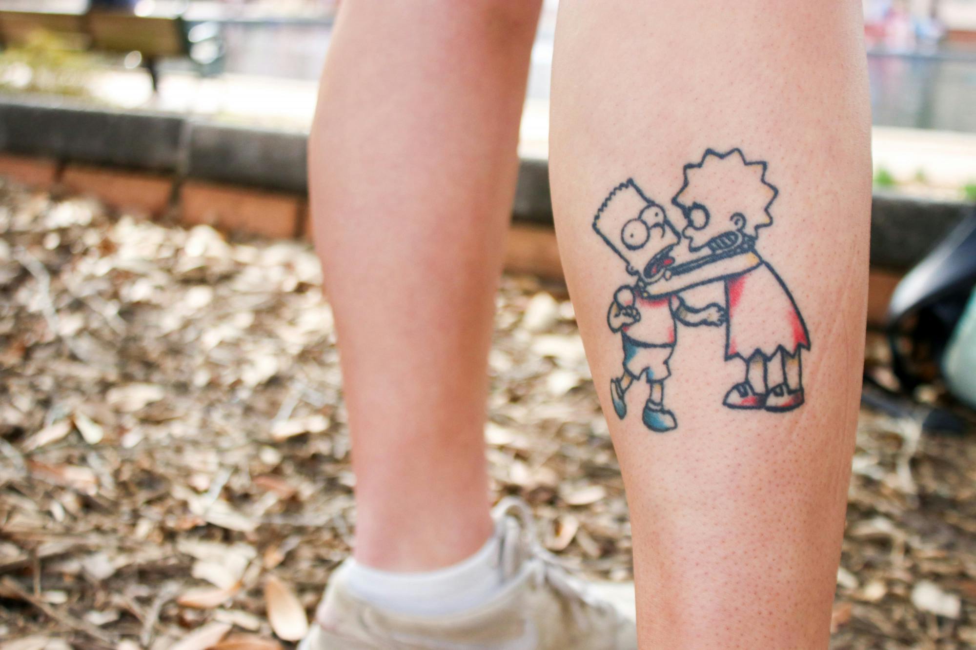 This Simpsons tattoo looks minimalist  but is actually an insane optical  illusion