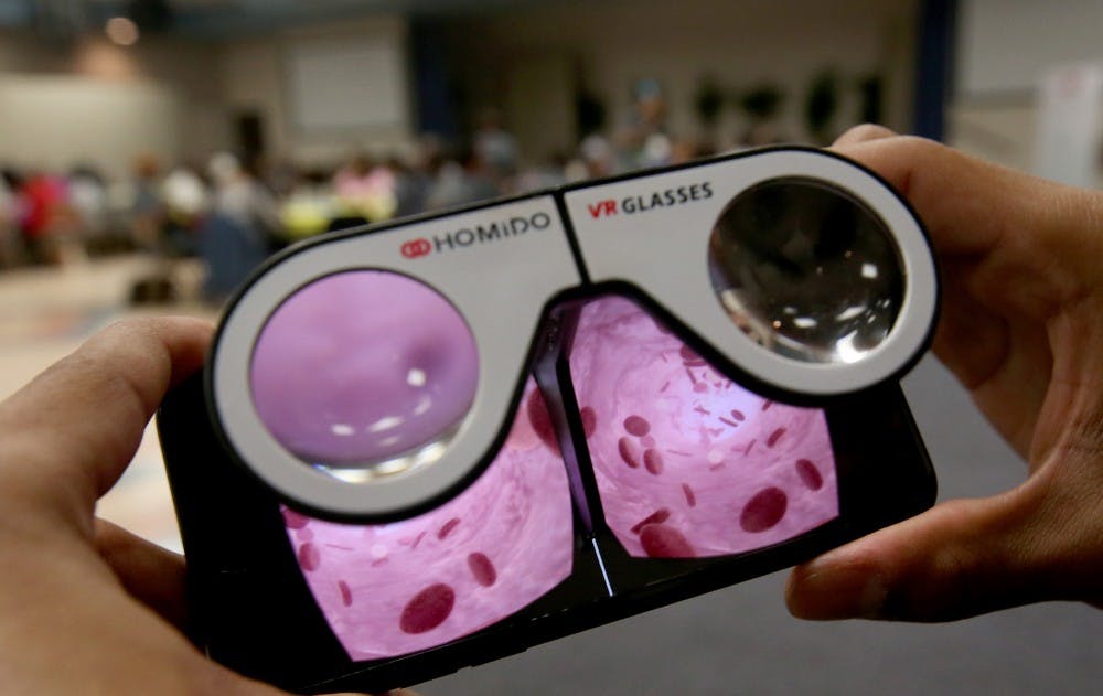 Techinician Ryan Anderson demonstrates a virtual reality video on his mobile phone that focuses on different foods and their sodium content on April 24, 2017 in Los Angeles. The Sodium Healthy Living Program at Holman Methodist Church in Los Angeles is a partnership with Cedars-Sinai Hospital and tries to help African Americans lower their blood pressure through diet and exercise. (Luis Sinco/Los Angeles Times/TNS) 