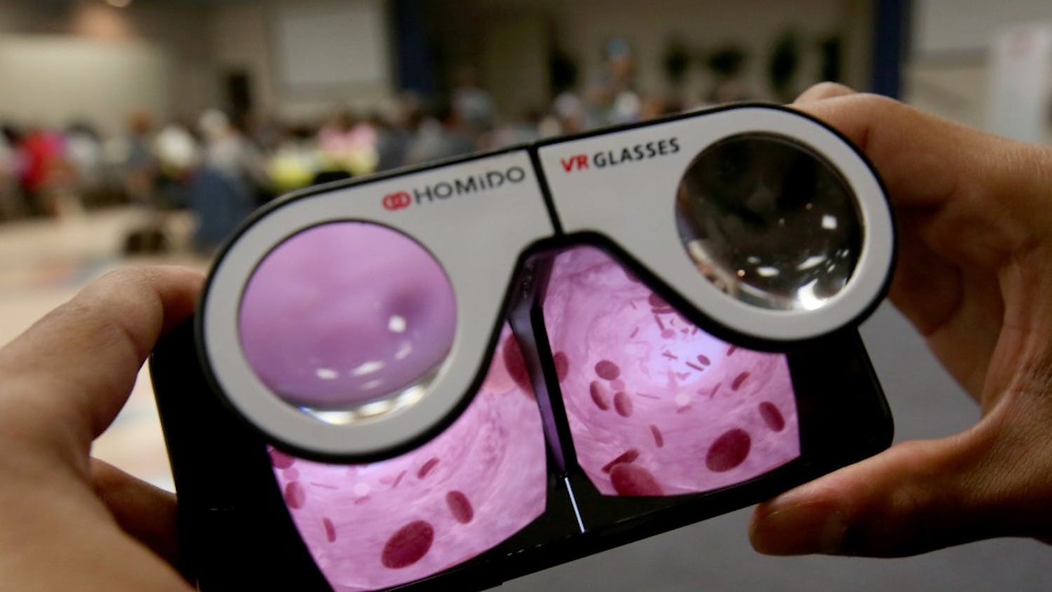 Techinician Ryan Anderson demonstrates a virtual reality video on his mobile phone that focuses on different foods and their sodium content on April 24, 2017 in Los Angeles. The Sodium Healthy Living Program at Holman Methodist Church in Los Angeles is a partnership with Cedars-Sinai Hospital and tries to help African Americans lower their blood pressure through diet and exercise. (Luis Sinco/Los Angeles Times/TNS)