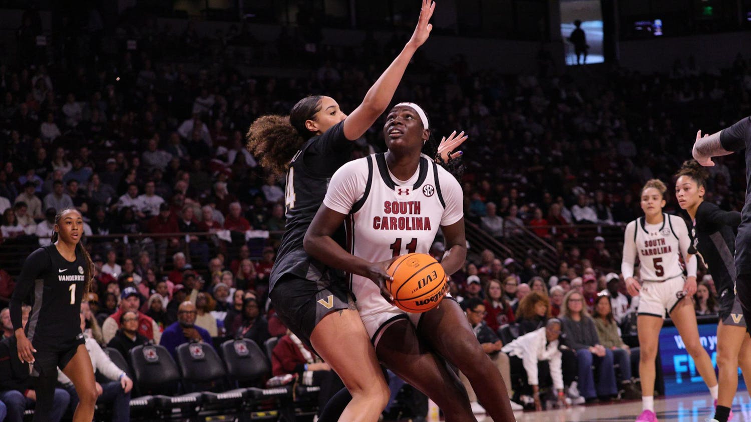 Senior center Madina Okot goes up for a layup during the Gamecocks’ matchup with Vanderbilt at Colonial Life Arena on Jan. 25, 2026. She takes the shot while a defender reaches in to stop her.