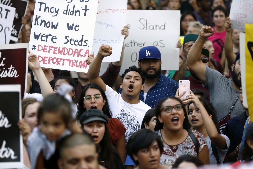 Protesters gather to demonstrate against changes in the Deferred Action for Childhood Arrivals (DACA) immigration policy at City Hall in Los Angeles on September 5, 2017. President Trump decided to phase out the Deferred Action for Childhood Arrivals program. (Gary Coronado/Los Angeles Times/TNS)