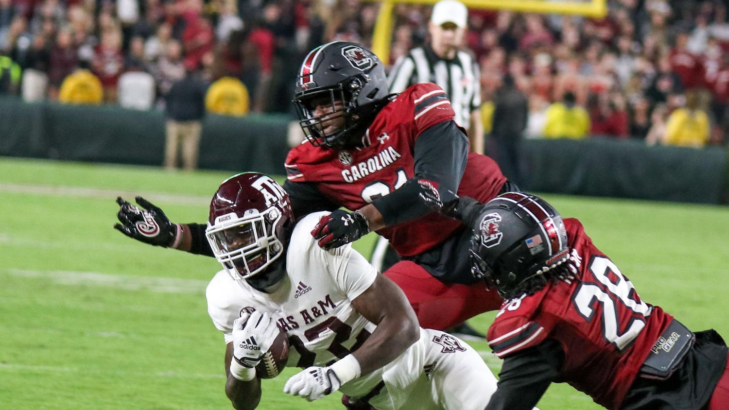 FILE - Then junior defensive lineman Tonka Hemingway and redshirt senior defensive back Darius Rush get the tackle during the fourth quarter against Texas A&M at Williams-Brice Stadium on Oct. 23, 2022. The Aggies return to Columbia on Saturday, Nov. 2, 2024.