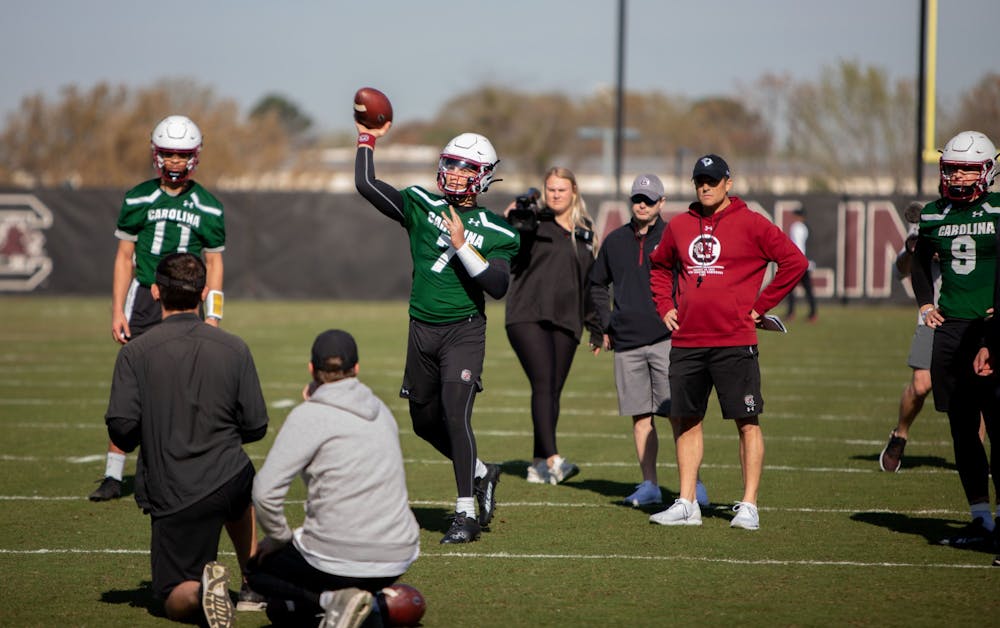 <p>FILE— Redshirt junior quarterback Spencer Rattler throws a football during a spring practice on Tuesday, March 15, 2022.&nbsp;</p>
