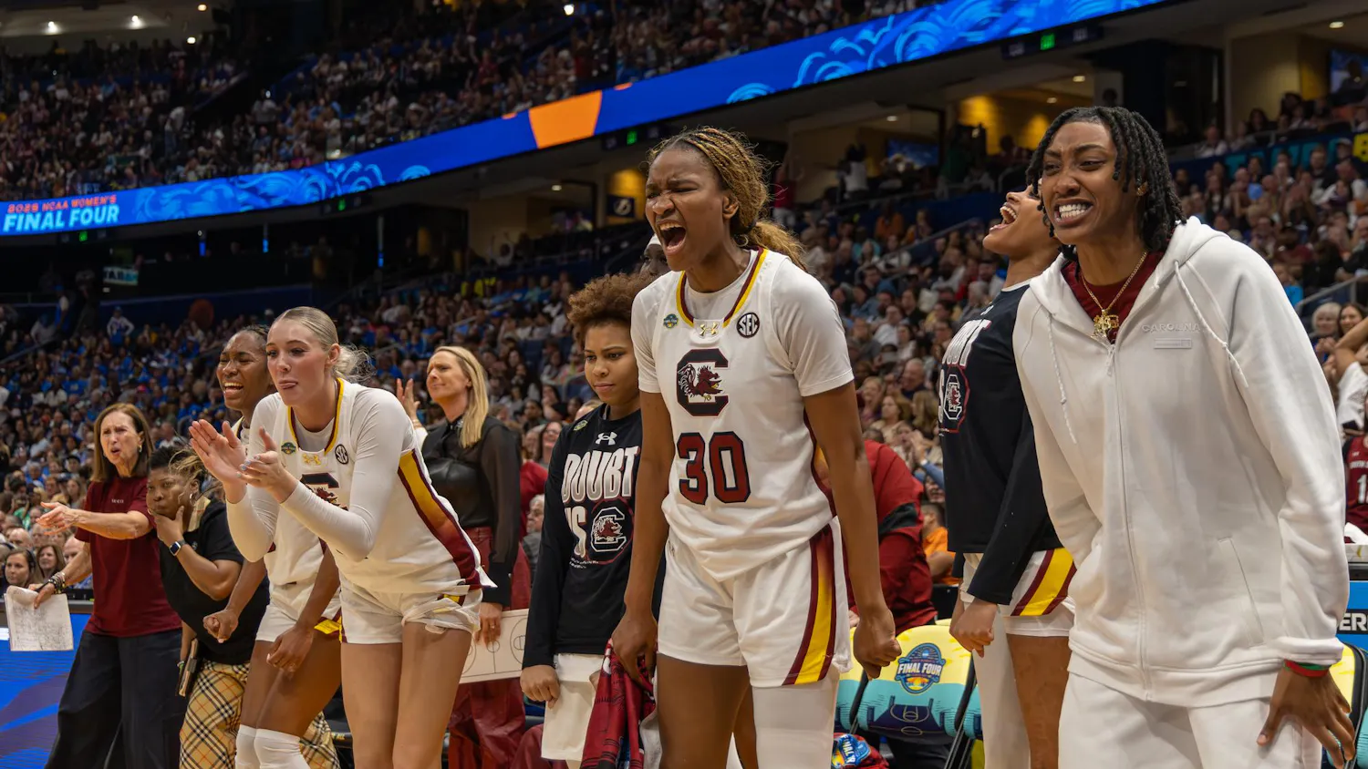 FILE — The South Carolina women's basketball bench celebrates after drawing a foul against Texas in the fourth quarter of their Final Four matchup on April 4, 2025 at Amalie Arena. The Gamecocks defeated the Longhorns 74-57 with 35 points coming from the bench.