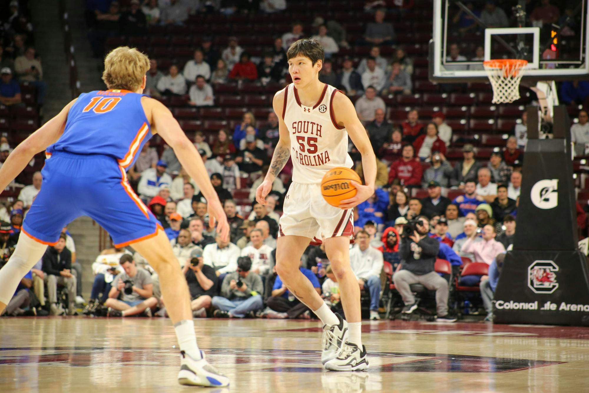 Senior guard Mike Sharavjamts looks for a player to pass to on Jan. 28, 2026, at the Colonial Life Arena. The Gamecocks played against the Gators and lost 95-48.