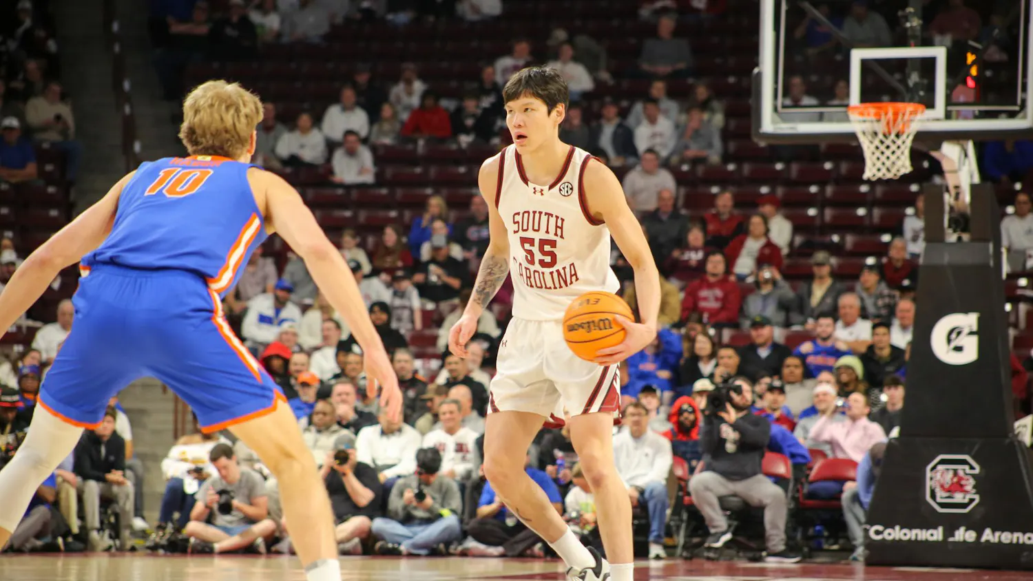 Senior guard Mike Sharavjamts looks for a player to pass to on Jan. 28, 2026, at the Colonial Life Arena. The Gamecocks played against the Gators and lost 95-48.
