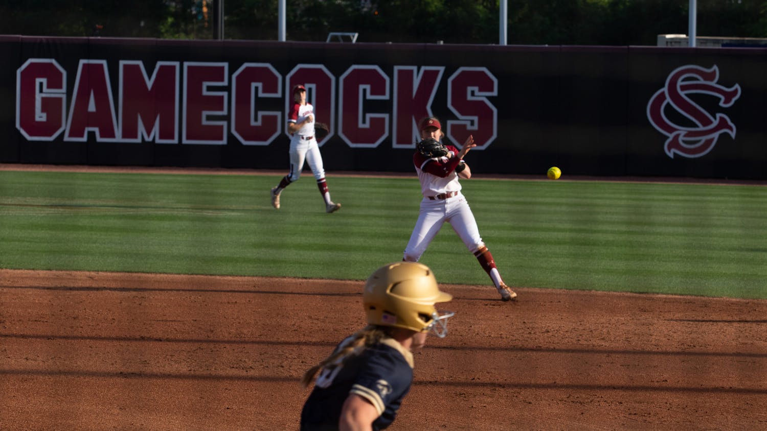 Sophomore infielder Emma Sellers throws a Charleston Southern runner out at first on April 19, 2023. Sellers registered two RBIs against the Buccaneers in game two, helping the Gamecocks to an 11-2 win.