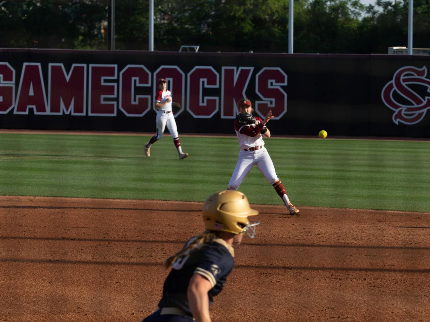 Sophomore infielder Emma Sellers throws a Charleston Southern runner out at first on April 19, 2023. Sellers registered two RBIs against the Buccaneers in game two, helping the Gamecocks to an 11-2 win.