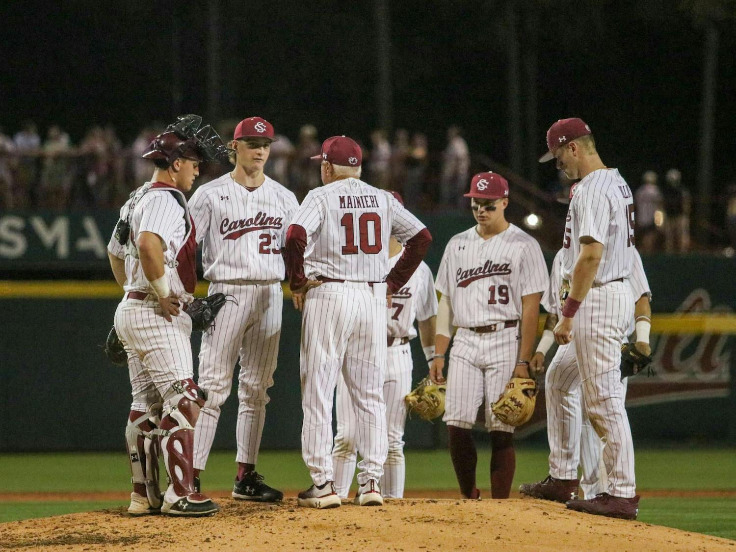 Head coach Paul Mainieri and several of the South Carolina Gamecocks huddle up to discuss their plan going forward in their game against Tennessee at Founders Park on March 28, 2025. Mainieri took over the coaching position on June 11, 2024. 