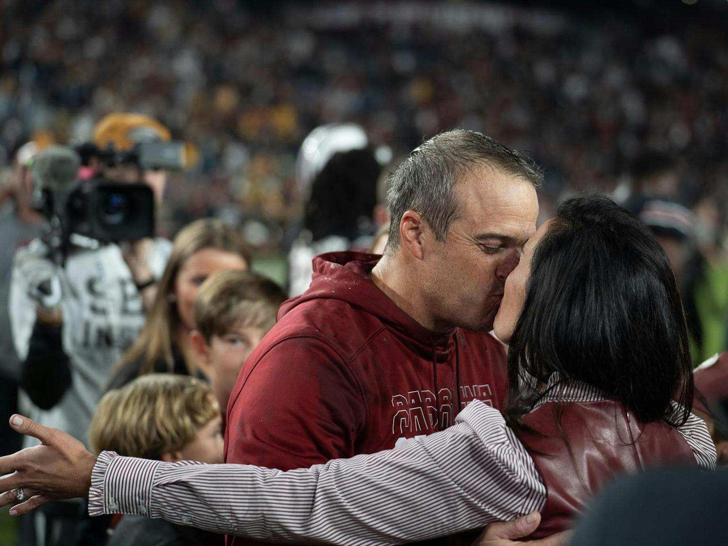 Head coach Shane Beamer celebrates his team defeating No. 23 Missouri with a kiss from his wife. This year marks Beamer's fourth year as head coach and his first win against the Tigers.