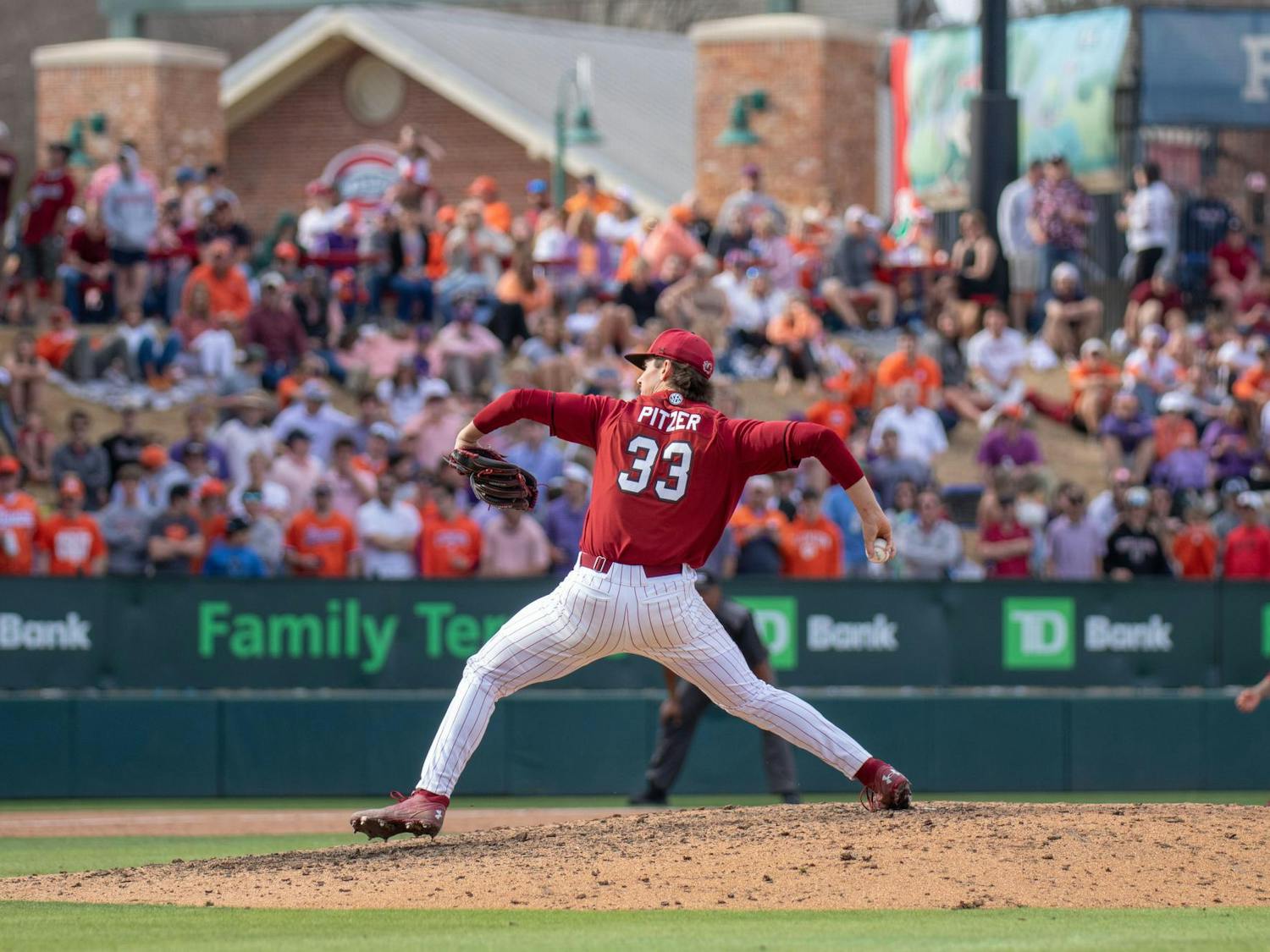 Sophomore right-handed pitcher Tyler Pitzer winds up for a pitch against Clemson at Fluor Field on March 1, 2025. South Carolina’s pitching staff tallied 15 strikeouts in the neutral site matchup. 