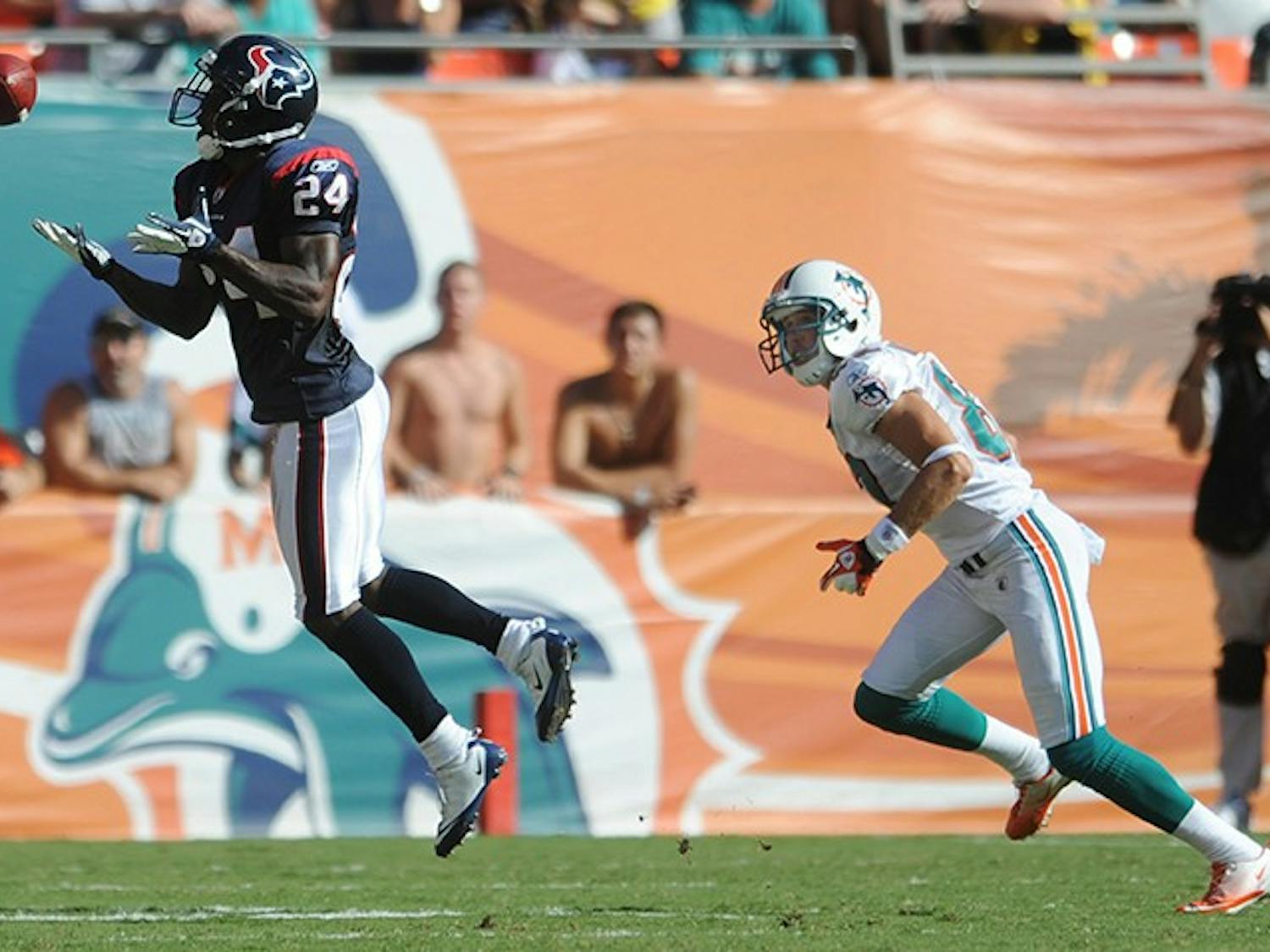 Jonathan Joseph of the Texans intercepts a pass intended for Brian Hartline of the Dolphins. The Houston Texans defeated the Miami Dolphins, 23-13, at Sun Life Stadium in Miami Gardens, Florida, Sunday, September 18, 2011. (Jim Rassol/Sun Sentinel/MCT)