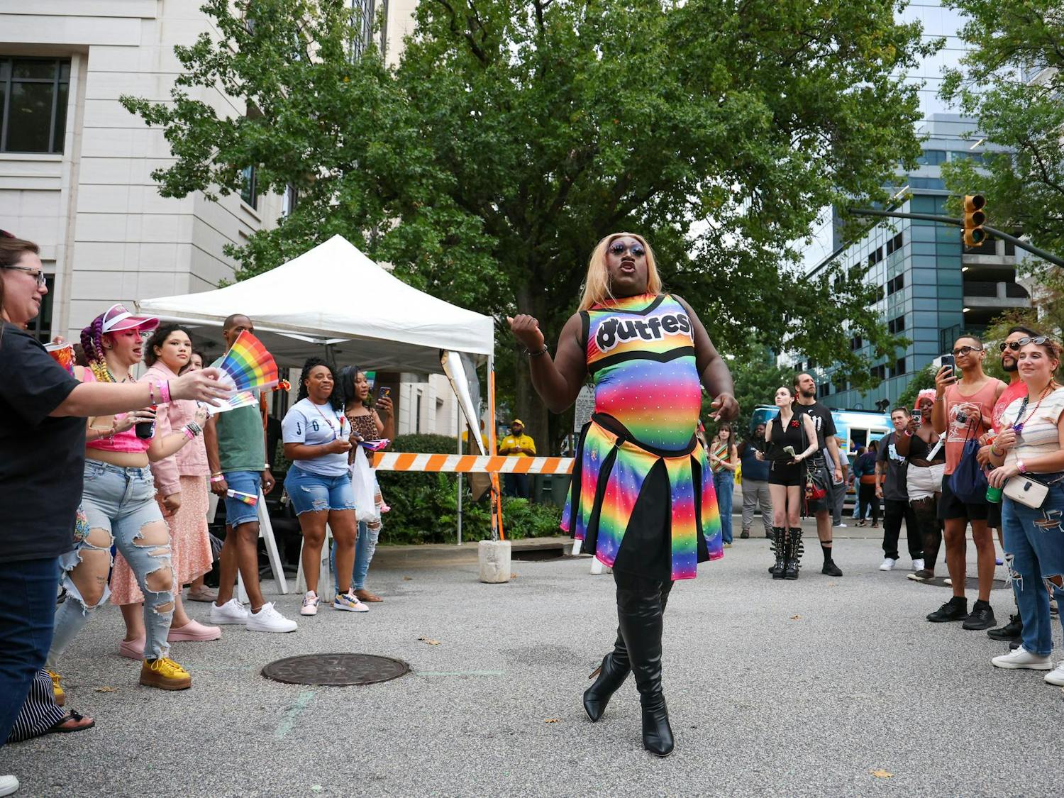 Columbia drag queen Hellen Heels vogues down the middle of a crowd during Outfest Hour at the Famously Hot SC Pride Festival on Oct. 4, 2025. Heels previously competed in the Outfest Pageant 2025