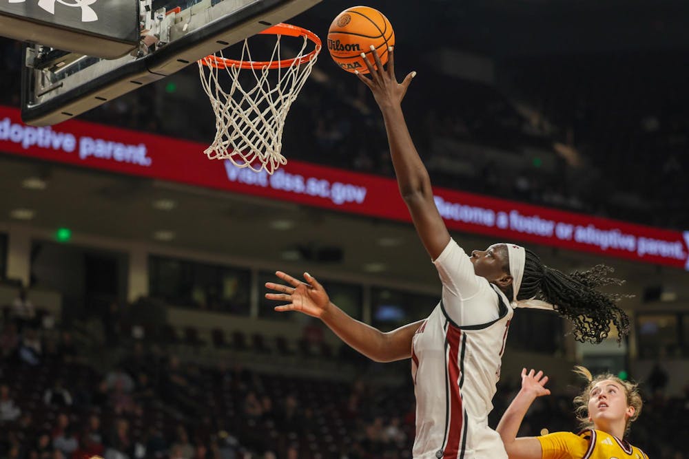 <p>FILE — Senior center Madina Okot cuts to the basket and scores against Winthrop on Nov. 19, 2025, at Colonial Life Arena. Okot has scored 138 points on the season for the Gamecocks.</p>
