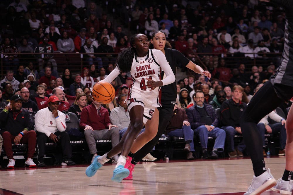 <p>Freshman guard Agot Makeer dribbles toward the basket during the Gamecocks’ matchup with Vanderbilt at Colonial Life Arena on Jan. 25. She moves past a defender as she drives in for a shot.</p>