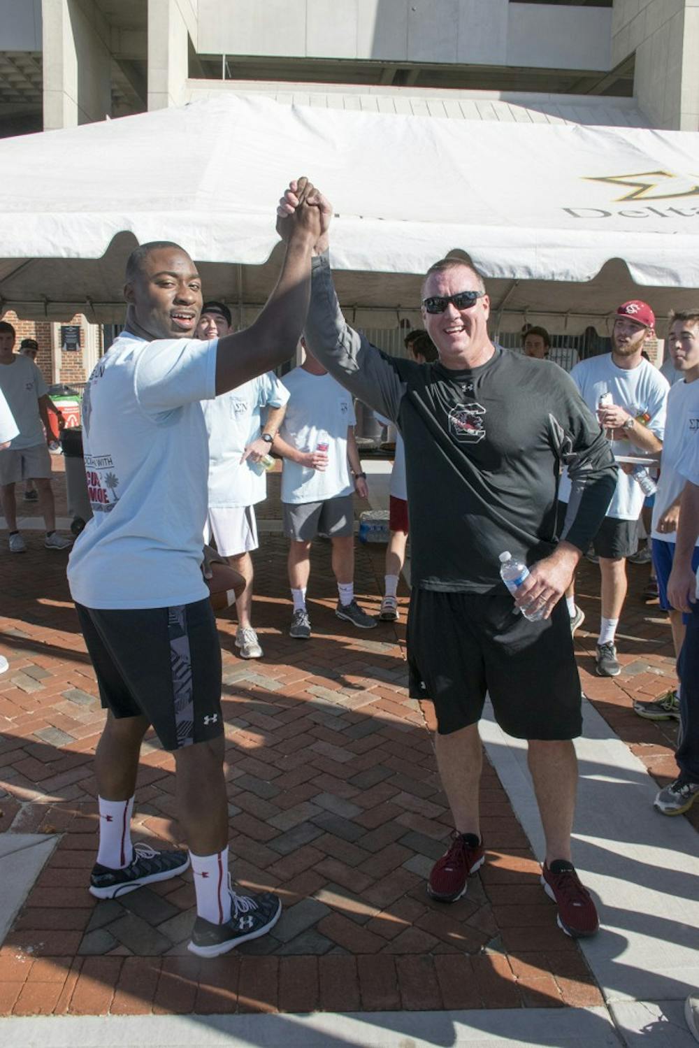<p>Former star running back Marcus Lattimore and Interim Head Coach Shawn Elliot came together to support Lattimore's foundation as a part of this year's annual Game Ball Run.</p>