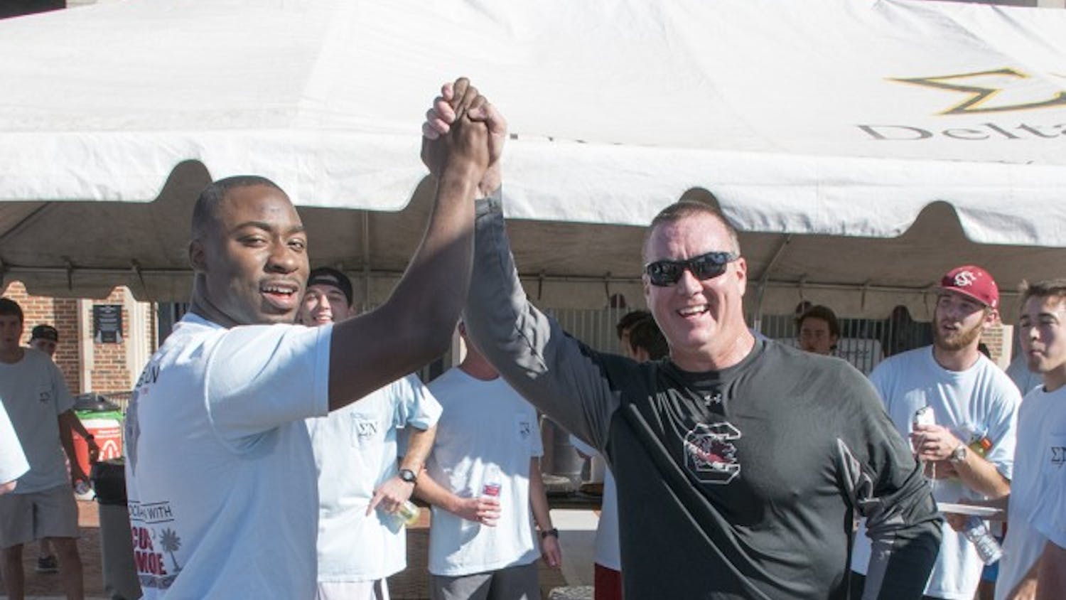 Former star running back Marcus Lattimore and Interim Head Coach Shawn Elliot came together to support Lattimore's foundation as a part of this year's annual Game Ball Run.