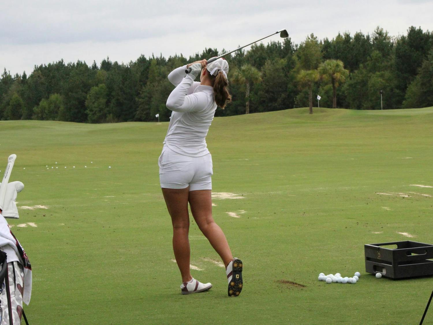 FILE - Senior Political Science major Sophia Burnett is practicing her swings before practice on Thursday, Sept. 28, 2023. The Gamecocks are now heading to their fourth straight national championship.
