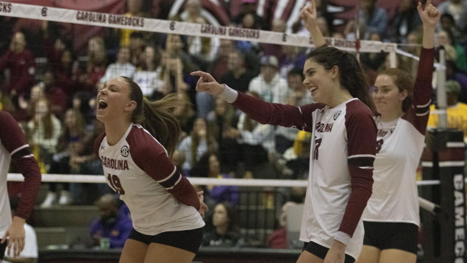 Freshman libero Elizabeth McElveen, sophomore outside hitter Alayna Johnson and senior middle blocker Ellie Ruprich celebrate winning a point in their game against LSU at the Carolina Volleyball Center on Nov. 12, 2023. The Gamecocks won the second and third sets but lost to the Tigers 3-2.