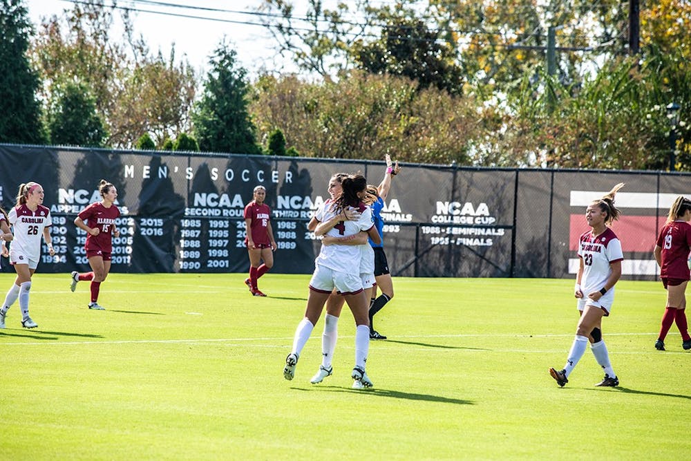 <p>Graduate defender Remi Swartz and graduate forward Ryan Gareis after scoring against Alabama on Oct. 24. The South Carolina women's soccer team won 2-0 against Penn State to reach the Elite Eight in the NCAA Tournament.&nbsp;</p>