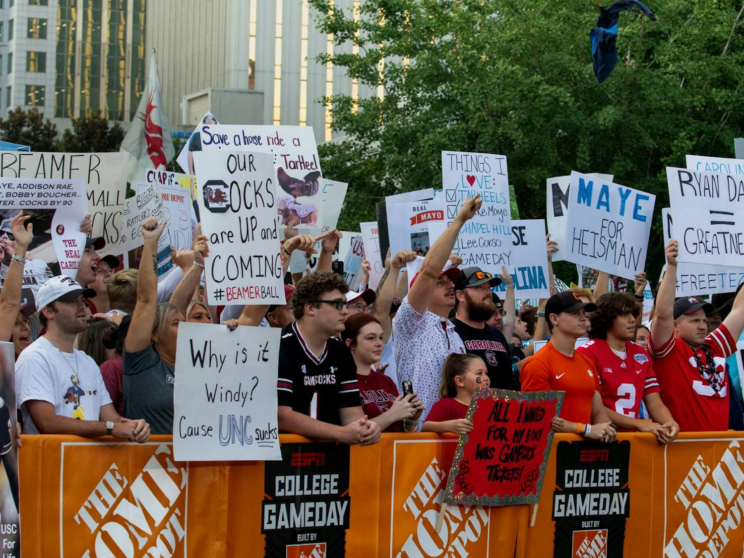 A mix of South Carolina and North Carolina fans in the front row for College GameDay. Fans from both sides brought signs supporting their team with the hope of being featured on the ESPN broadcast.