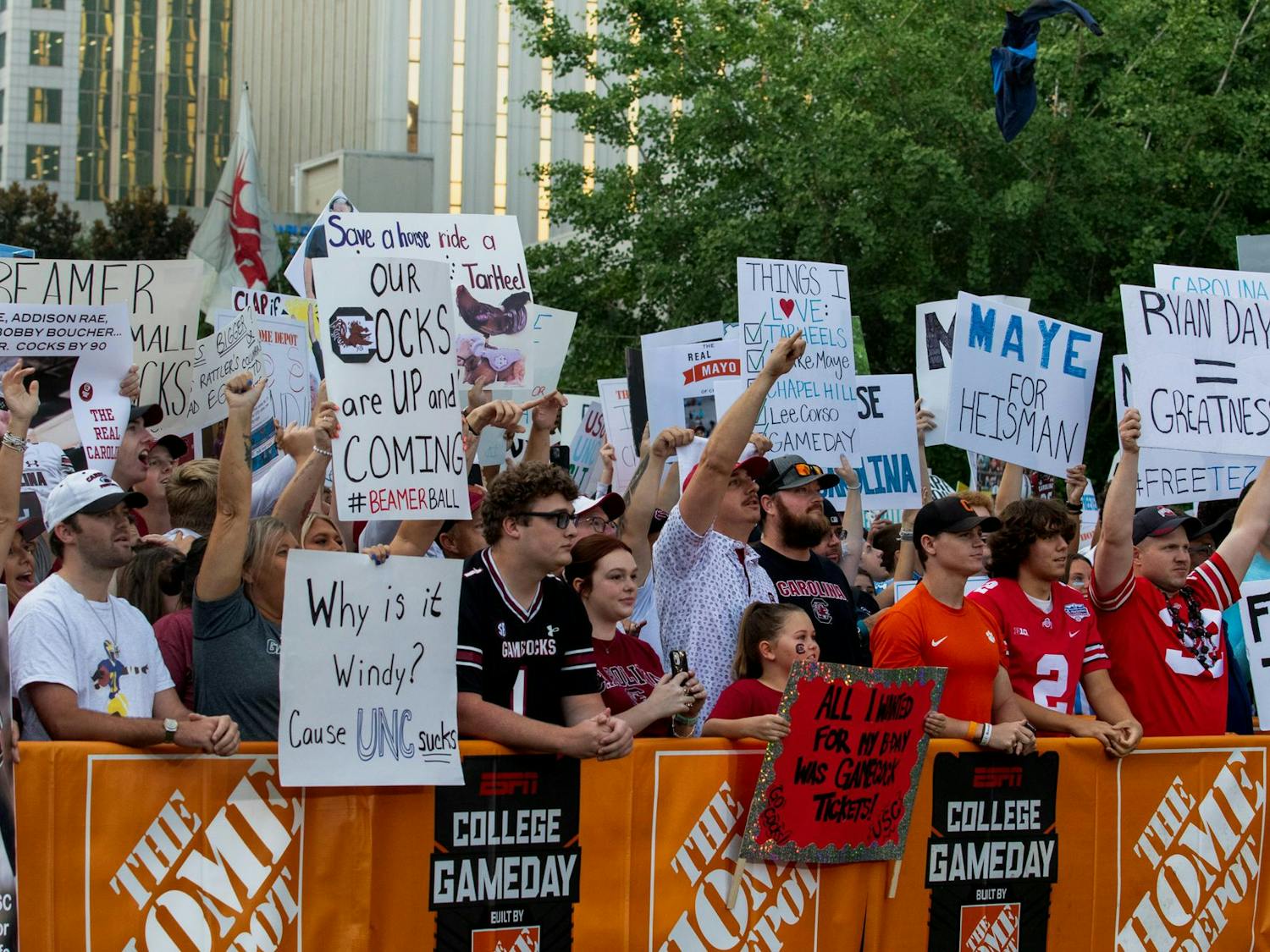 A mix of South Carolina and North Carolina fans in the front row for College GameDay. Fans from both sides brought signs supporting their team with the hope of being featured on the ESPN broadcast.
