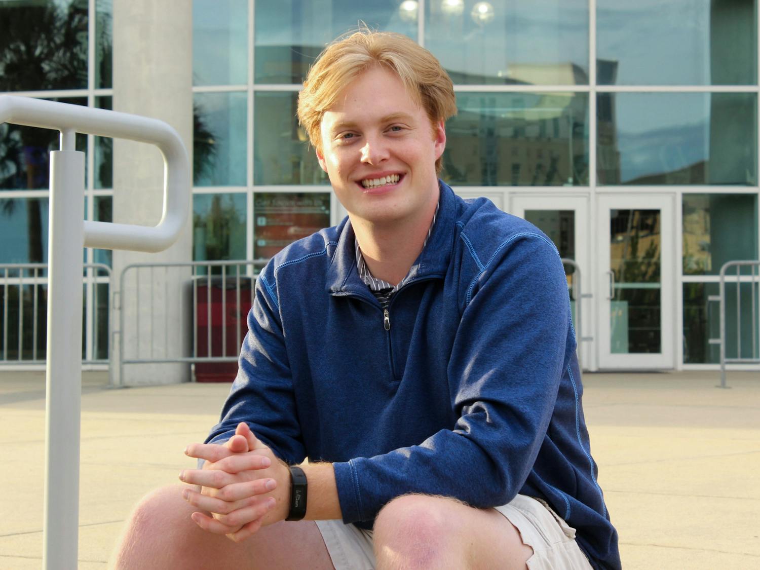 Michael Sauls, one of The Daily Gamecock’s managing editors, poses for a photo in front of Colonial Life Arena in Columbia, SC. Sauls has spent seven semester with The Daily Gamecock and is graduating from USC in December.