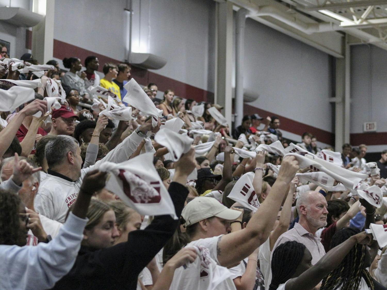 USC students crowd the bleachers to watch the women’s volleyball game against Texas A&M on Oct. 1, 2025, at the Carolina Volleyball Center. They swing their rally towels around as part of the college’s tradition. 