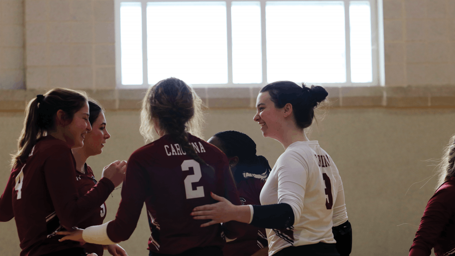 The women’s club volleyball garnet team comes together after a successful set against the College of Charleston at its home Gamecock Classic tournament on Feb. 4, 2023. The garnet team pictured, made up of junior outside Ashlee Johnstone, sophomore libero/DS Rachel Hebblethwaite, junior middle Maddie Mitchum, sophomore right side Alanna Harder and senior setter Preya Simmons, earned silver in the tournament after a hard fought match.